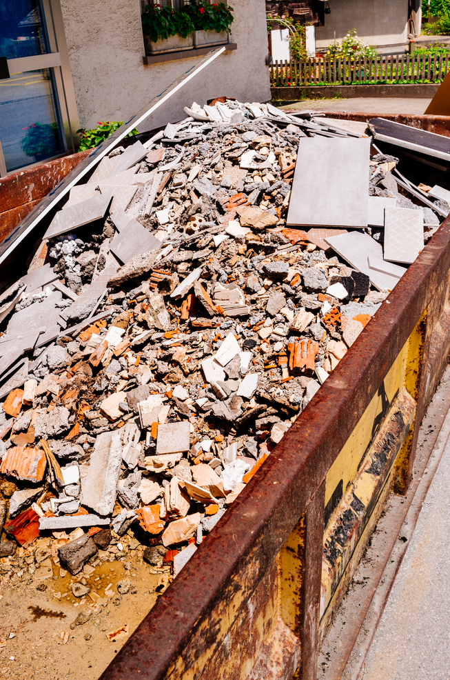 Garbage skip with building rubble